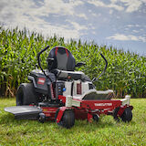 TimeCutter MyRide mower in front of a field of corn