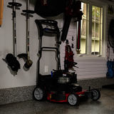 Toro TimeMaster Mower with handle straight up against the wall