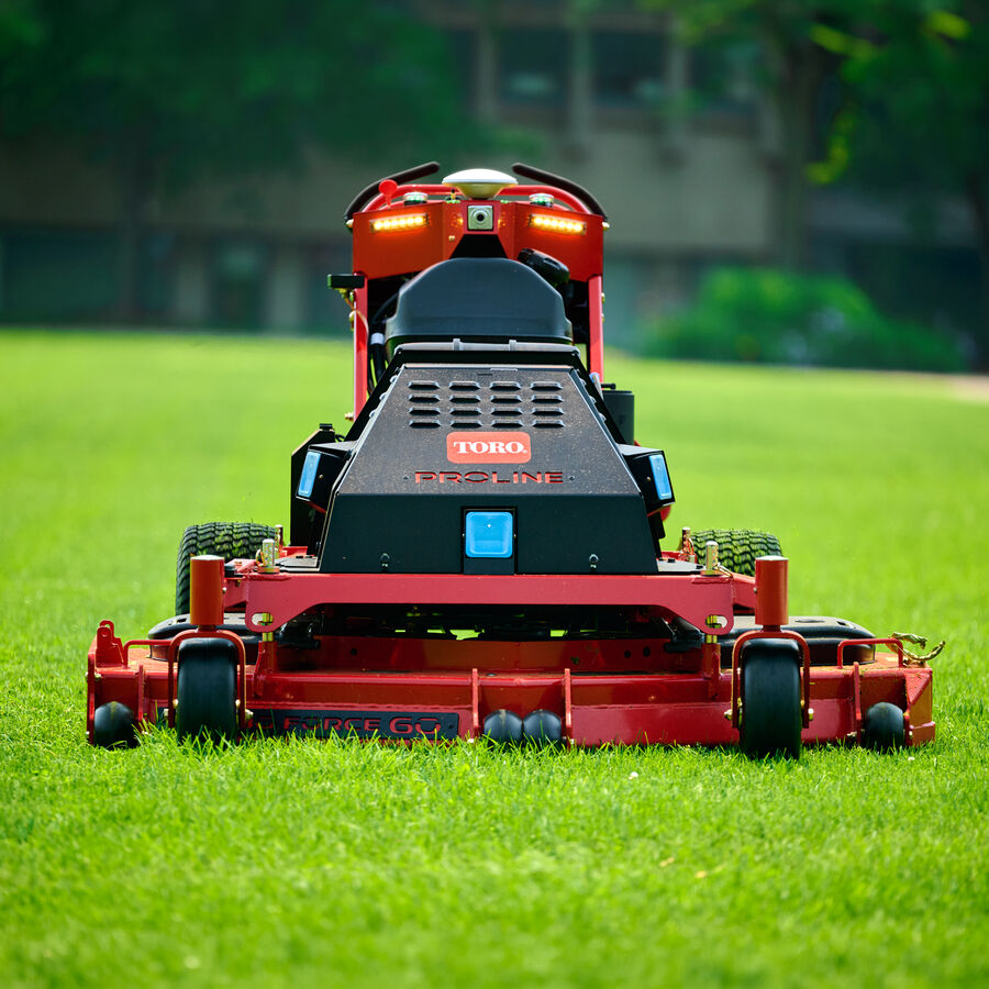 Toro Proline Autonomous Mower on grass with building behind