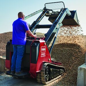 TXL2000 dumping rock in a rock pile