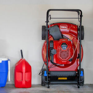Toro mower stowed against wall