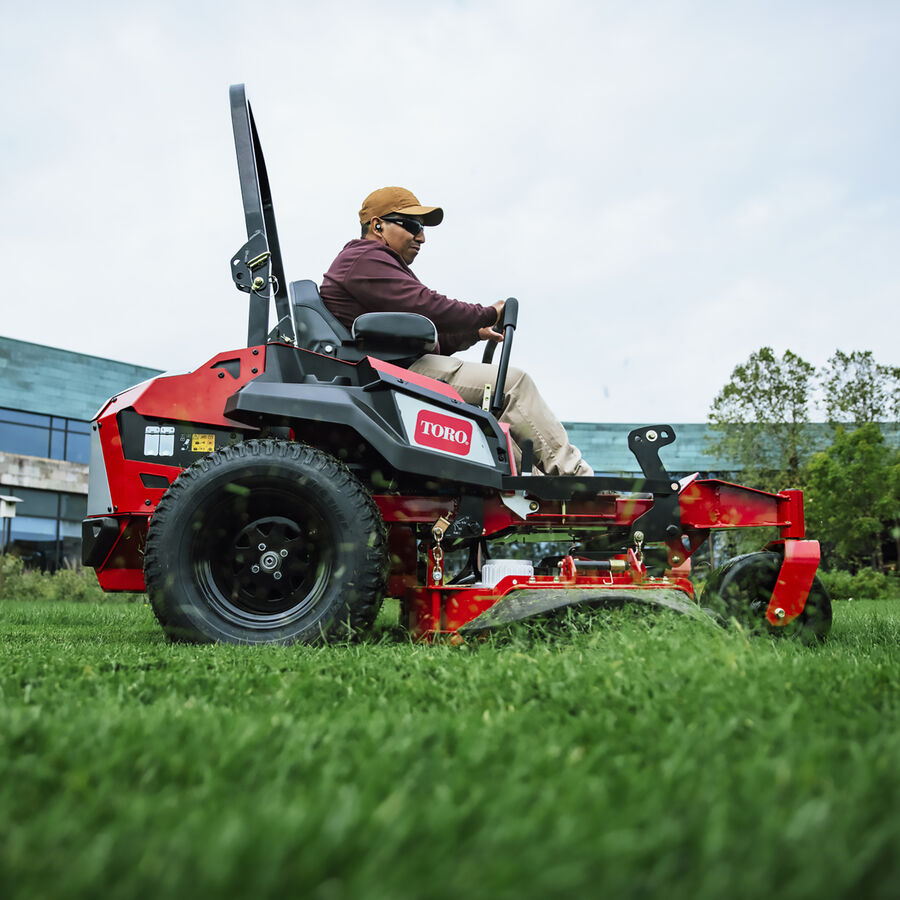 Z Master Revolution mower in use - mowing a lawn in front of a building