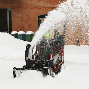 Dingo Snow Thrower Attachment - snow throwing a road with the Dingo TX 1000