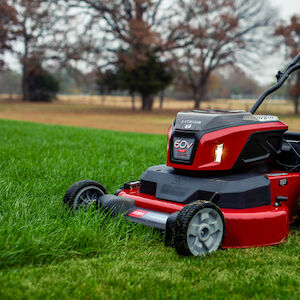 LED Headlights - Mower cutting grass with headlights on