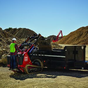 Dingo TX1300 dropping dirt.