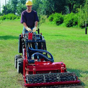 Dingo 320-D with the soil cultivator attachment