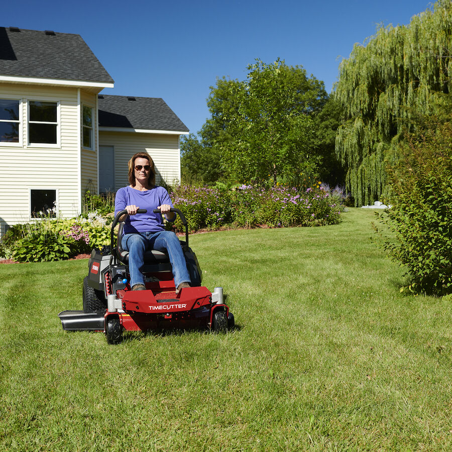 TimeCutter mower - woman cutting lawn