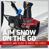 Aim snow on the go - squeeze and slide to move the chute.