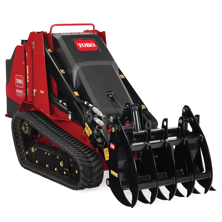 TX 700 wide track loader right side with a grapple rake attachment