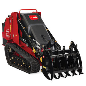 TX 700 wide track loader right side with a grapple rake attachment
