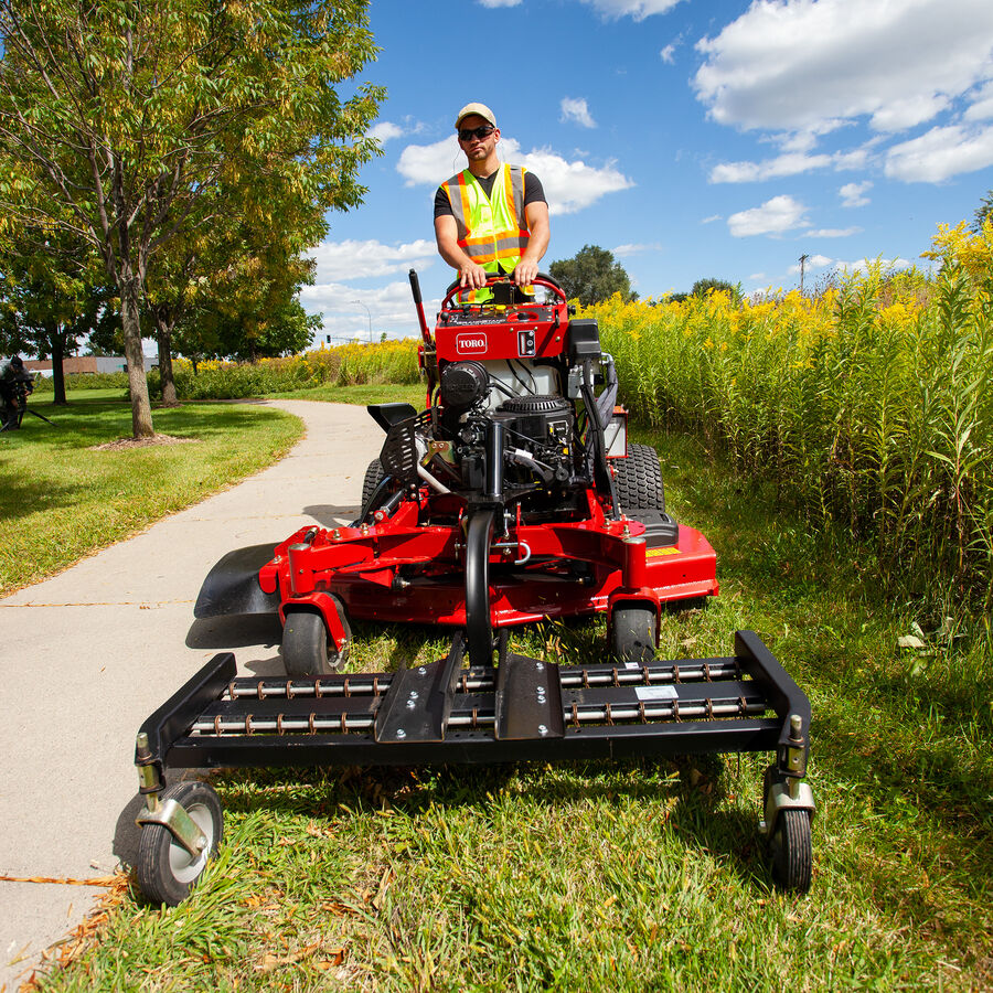 GrandStand® MULTI FORCE Dethatcher Attachment in Use