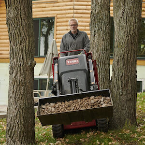 TX700 hauling rock going through trees
