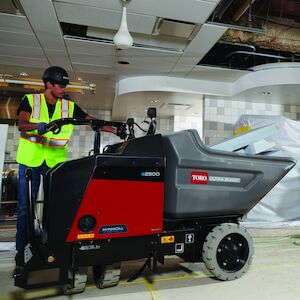 Electric Ultra Buggy inside a building operating by a white male.