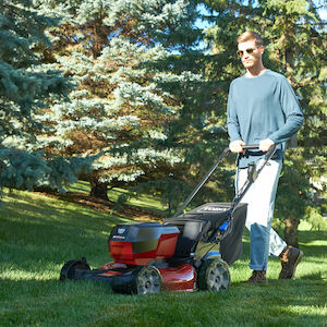 Man mowing lawn with Toro mower