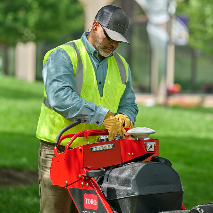 A landscape contractor using Toro Proline Autonomous Mower controls