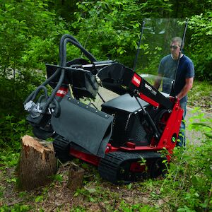 Dingo Stump Grinder attachment removing a stump
